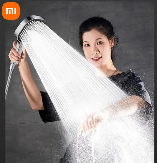 woman demonstrating the spray pattern of the  high pressure shower head 